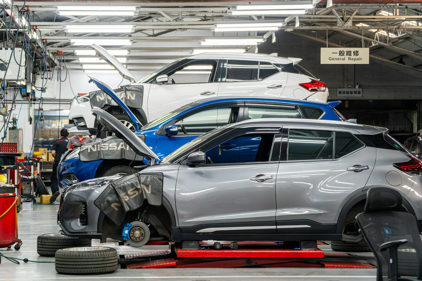 Cars being repaired in the Asimo Motors workshop